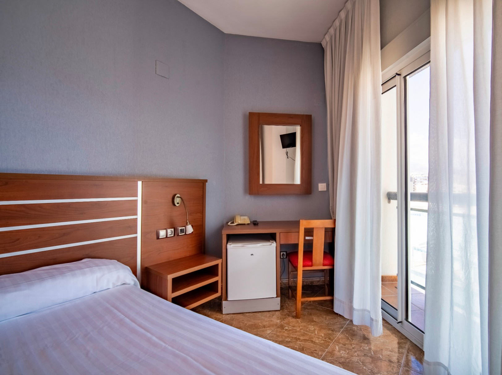 The building Hotel La Familia Gallo Rojo, located in El Campello, next to the beach.