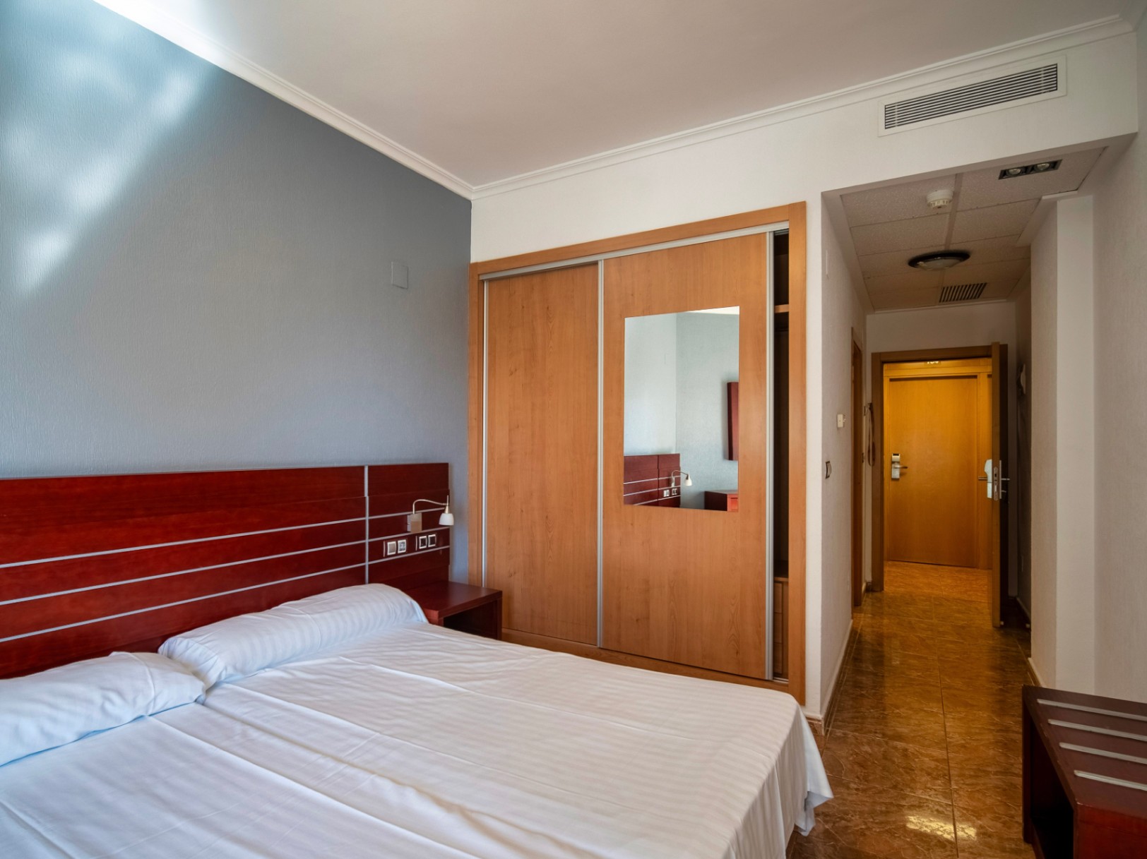 The building Hotel La Familia Gallo Rojo, located in El Campello, next to the beach.