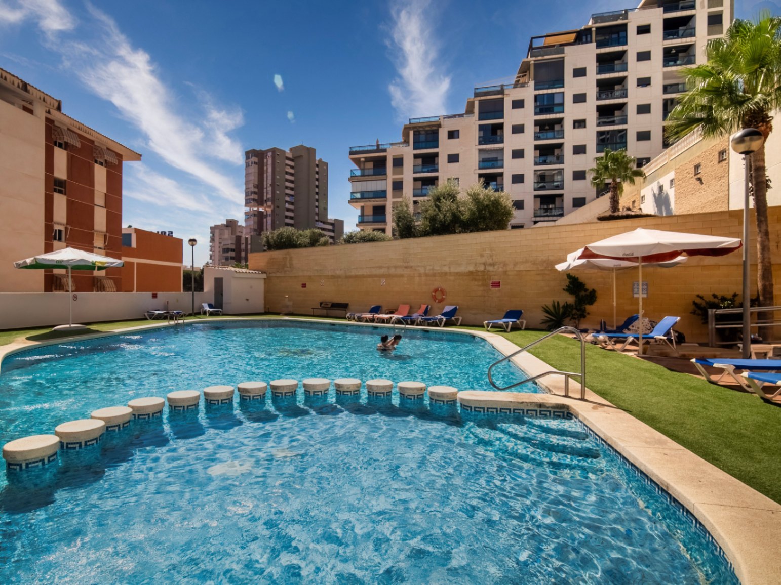 The building Hotel La Familia Gallo Rojo, located in El Campello, next to the beach.