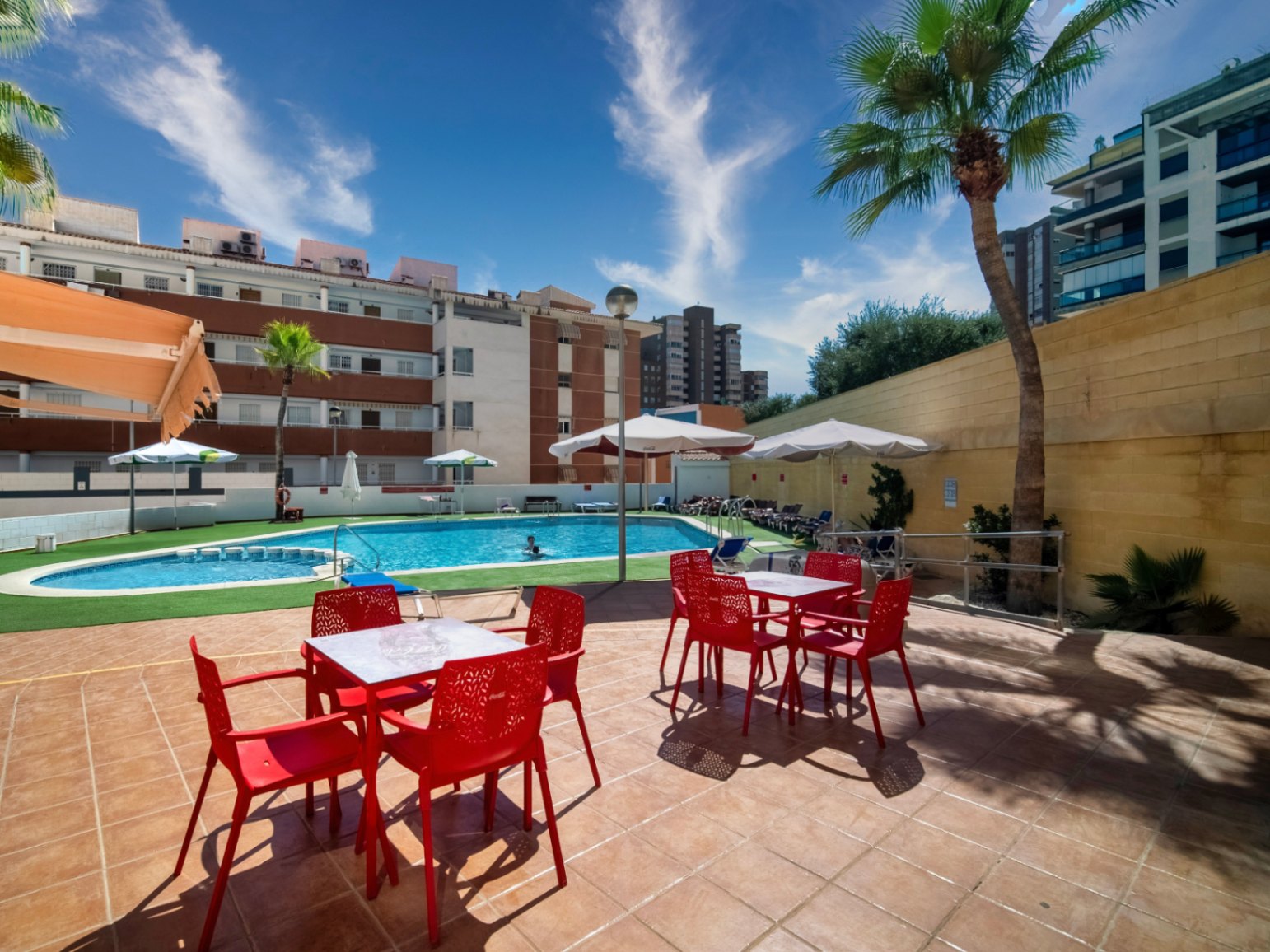 The building Hotel La Familia Gallo Rojo, located in El Campello, next to the beach.