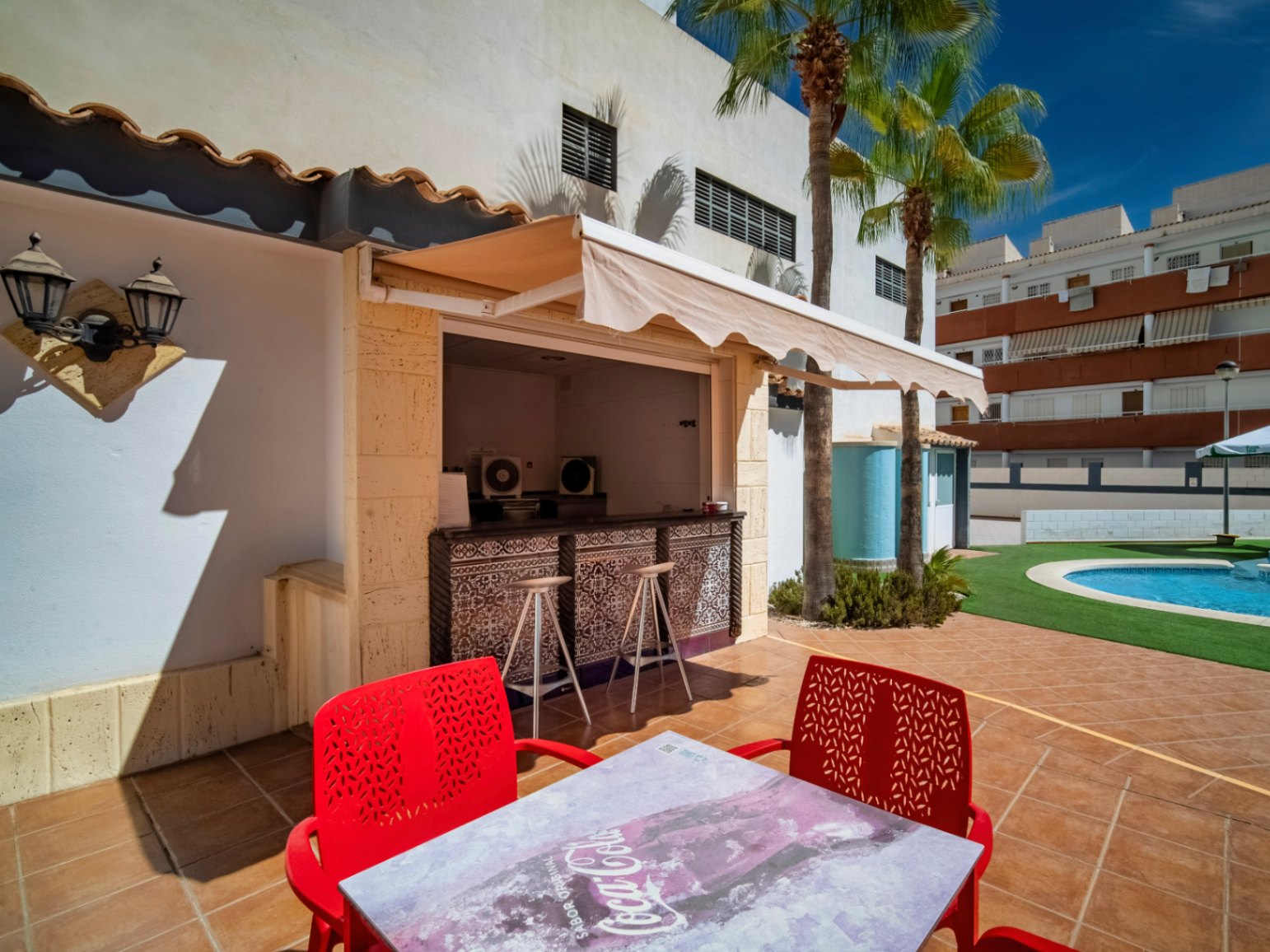 The building Hotel La Familia Gallo Rojo, located in El Campello, next to the beach.